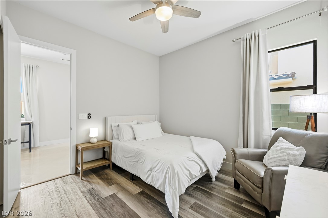 45 Garibaldi Way Henderson, NV 89011 - Photo 22 of 74 Relax in this tranquil bedroom, featuring sleek wood flooring and a contemporary ceiling fan.