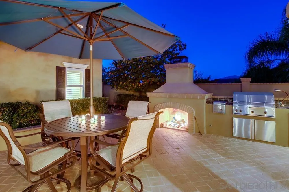 14476 Trailwind Road Poway, CA 92064 - Photo 11 of 61 a view of a dining room with furniture and chandelier