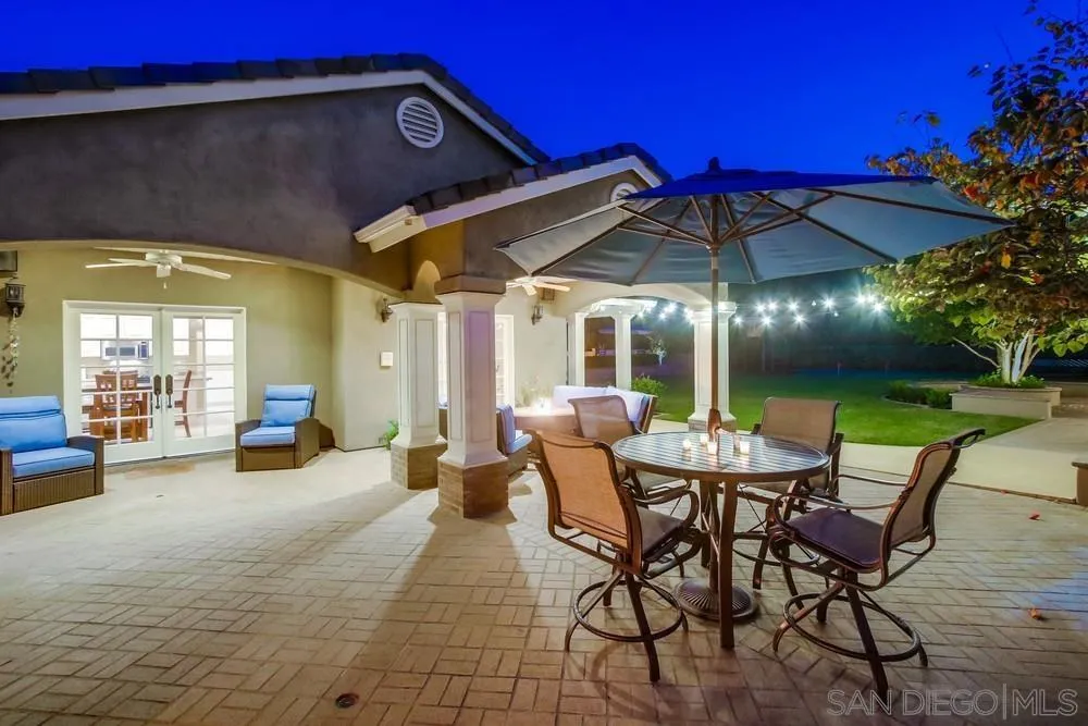 14476 Trailwind Road Poway, CA 92064 - Photo 12 of 61 a view of a patio with a table and chairs under an umbrella