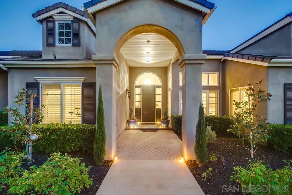 14476 Trailwind Road Poway, CA 92064 - Photo 17 of 61 a view of a house with large windows and a pathway