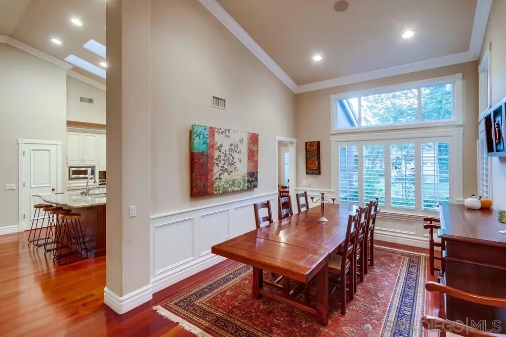 14476 Trailwind Road Poway, CA 92064 - Photo 19 of 61 a living room with furniture a table and wooden floor
