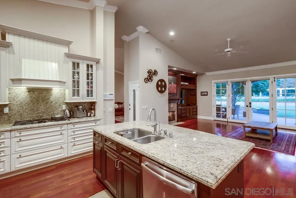 14476 Trailwind Road Poway, CA 92064 - Photo 21 of 61 a kitchen with stainless steel appliances granite countertop a sink stove and cabinets