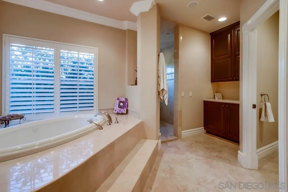 14476 Trailwind Road Poway, CA 92064 - Photo 32 of 61 a bathroom with a bathtub and a sink