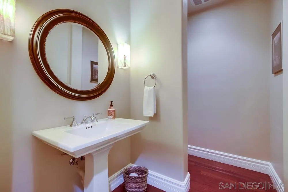 14476 Trailwind Road Poway, CA 92064 - Photo 35 of 61 a bathroom with a sink and a mirror