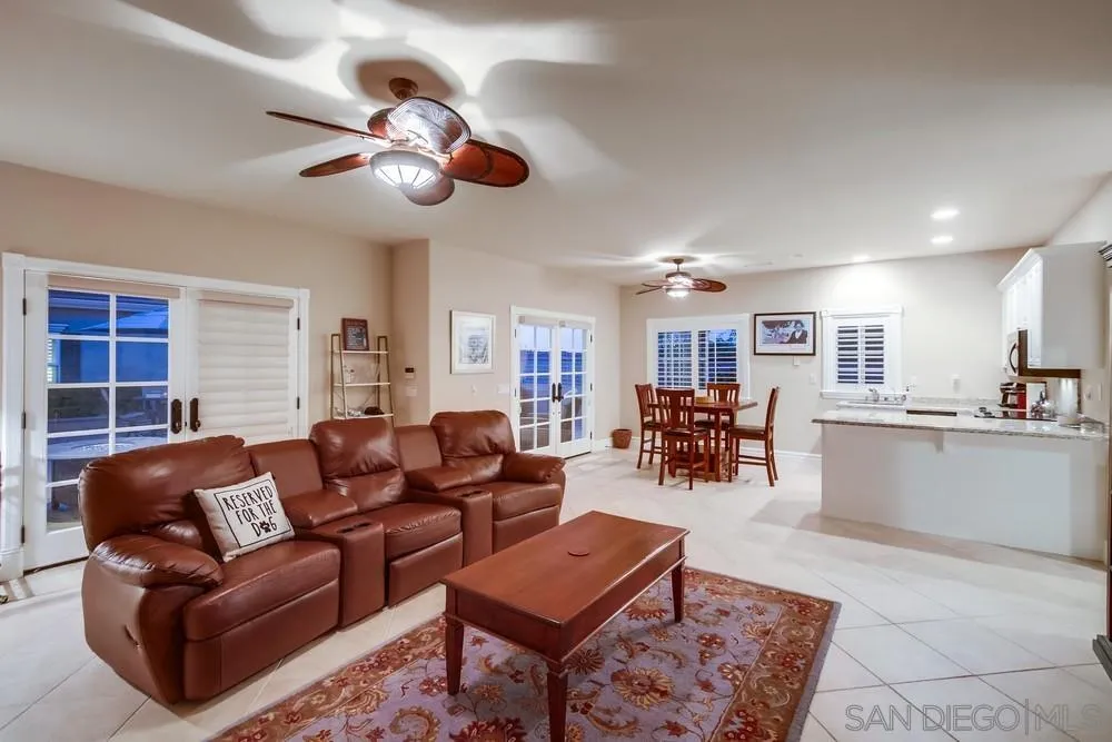 14476 Trailwind Road Poway, CA 92064 - Photo 39 of 61 a living room with furniture a dining table and kitchen view
