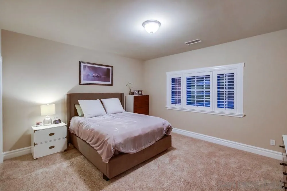 14476 Trailwind Road Poway, CA 92064 - Photo 41 of 61 a bedroom with a bed and a window