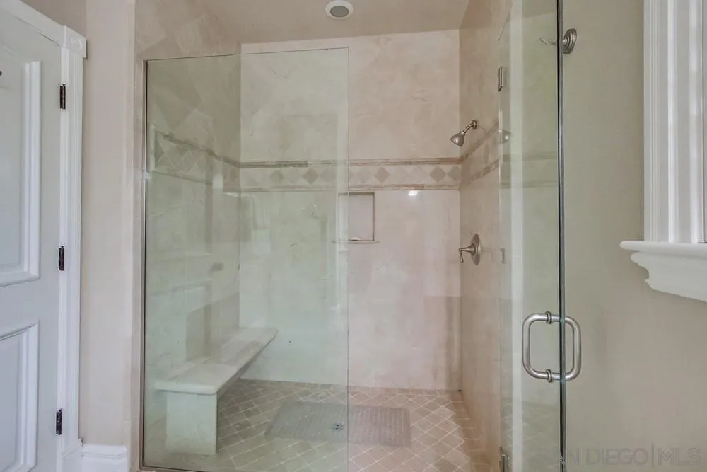 14476 Trailwind Road Poway, CA 92064 - Photo 43 of 61 a bathroom with a glass shower door