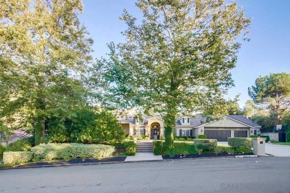 14476 Trailwind Road Poway, CA 92064 - Photo 45 of 61 a front view of a house with a yard and garage