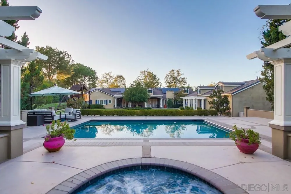 14476 Trailwind Road Poway, CA 92064 - Photo 51 of 61 a view of a swimming pool with potted plants