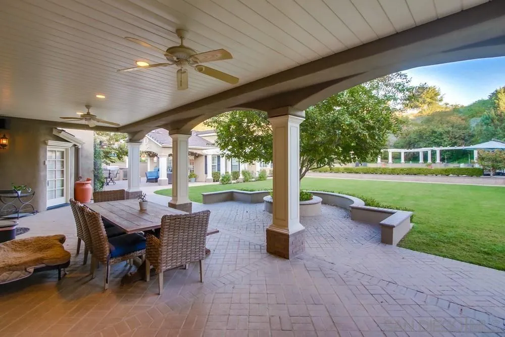 14476 Trailwind Road Poway, CA 92064 - Photo 52 of 61 a view of a patio with a table chairs and a patio