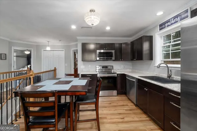 a view of a kitchen with fridge and rack