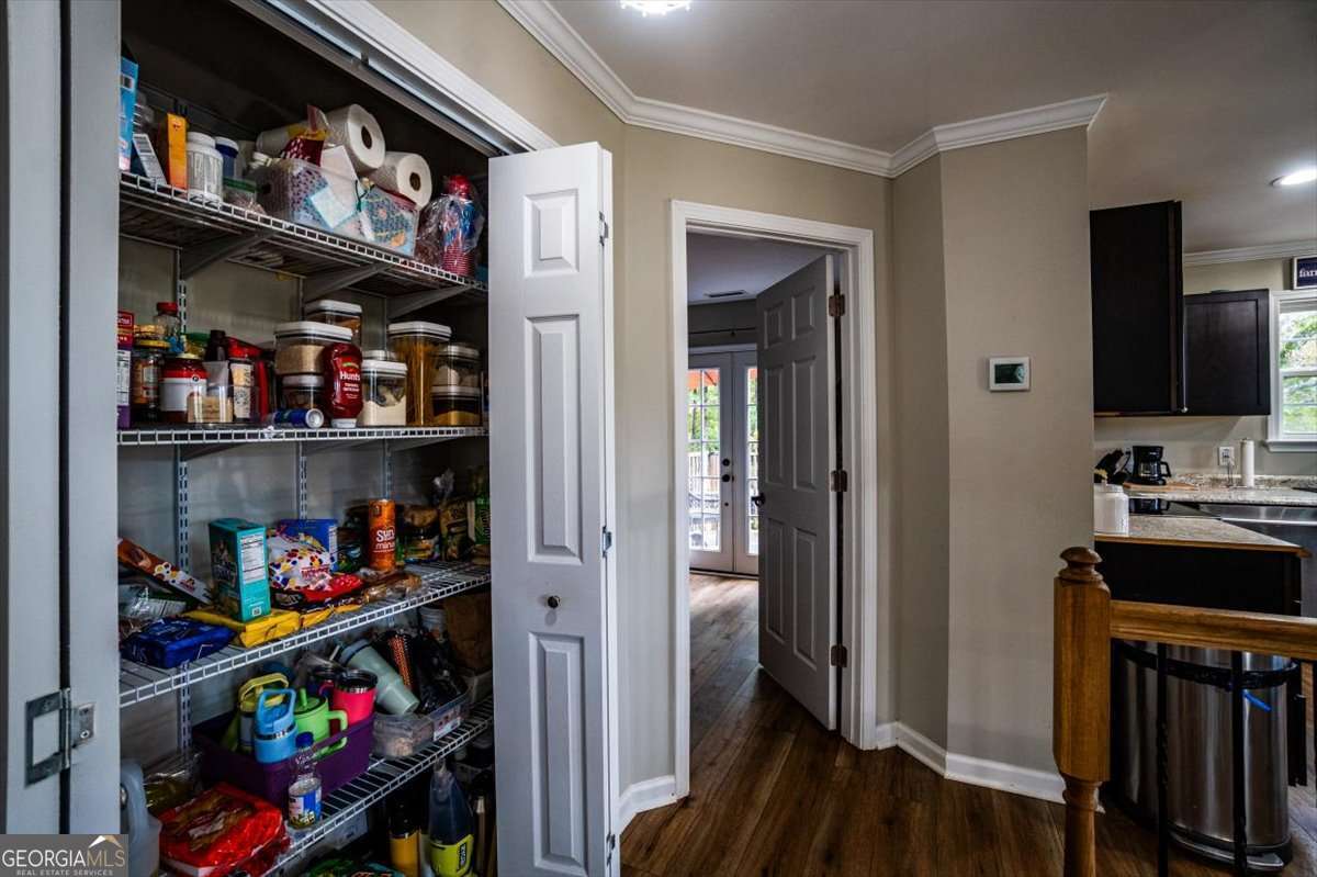 161 Archer Grove Road Athens, GA 30607 - Photo 15 of 56 a view of a kitchen with fridge and rack