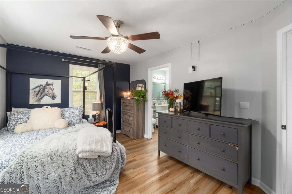 161 Archer Grove Road Athens, GA 30607 - Photo 20 of 56 a bedroom with a bed and a flat screen tv