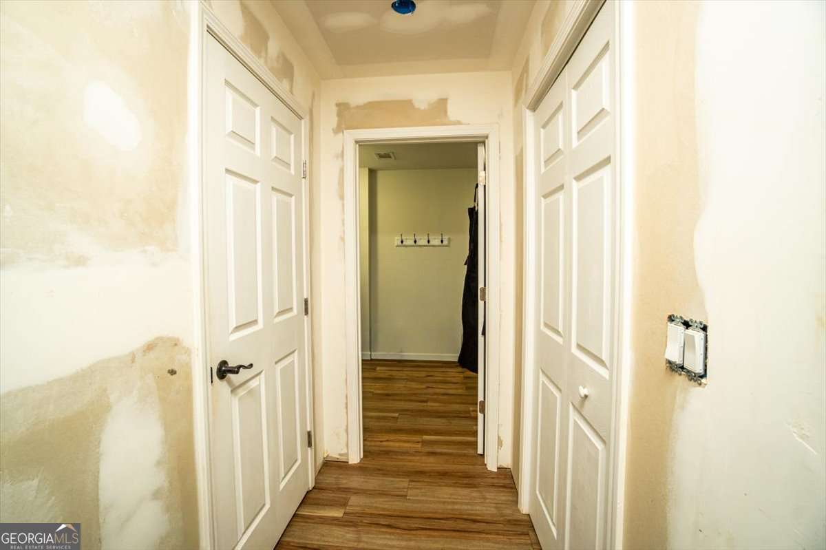 161 Archer Grove Road Athens, GA 30607 - Photo 22 of 56 a view of a hallway with a wooden door