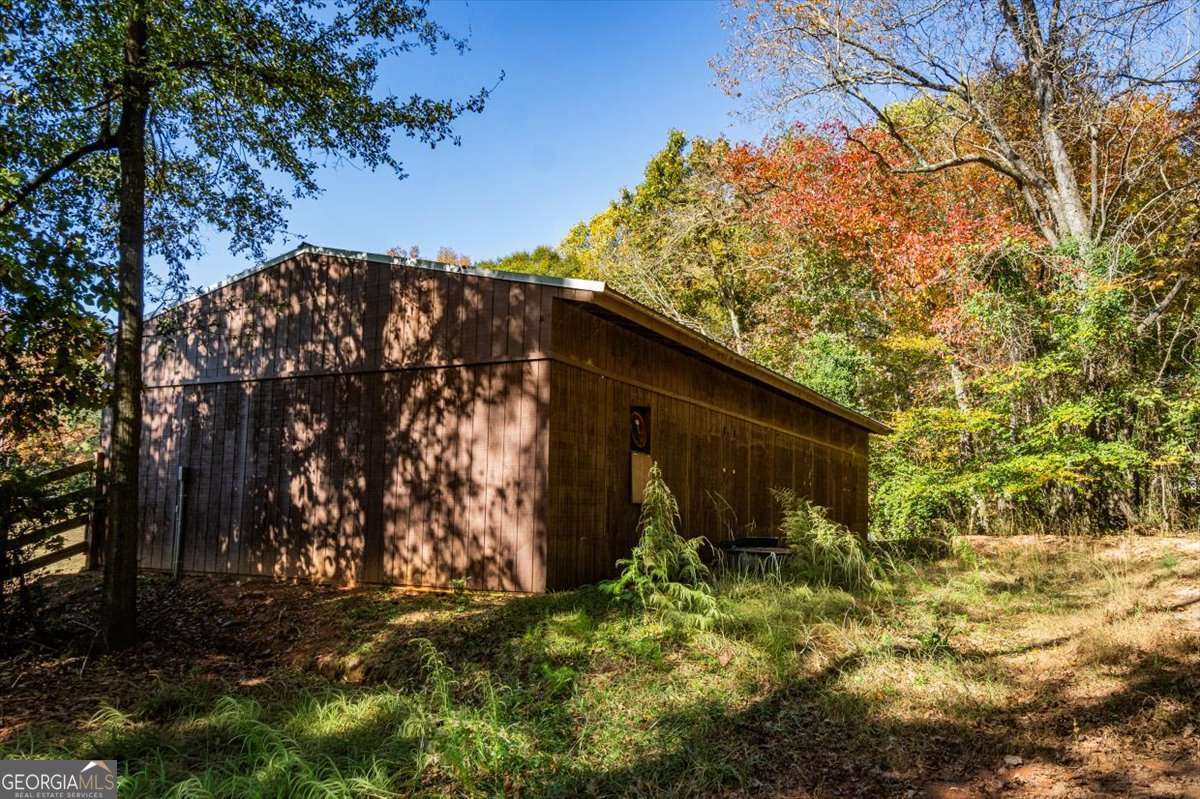 161 Archer Grove Road Athens, GA 30607 - Photo 28 of 56 a backyard of a house with lots of green space