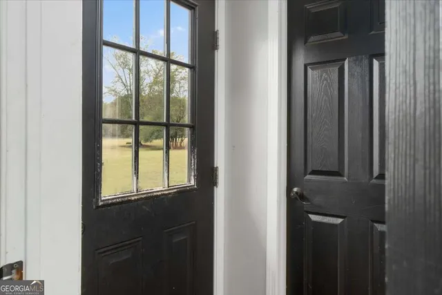 a view of entryway with wooden floor