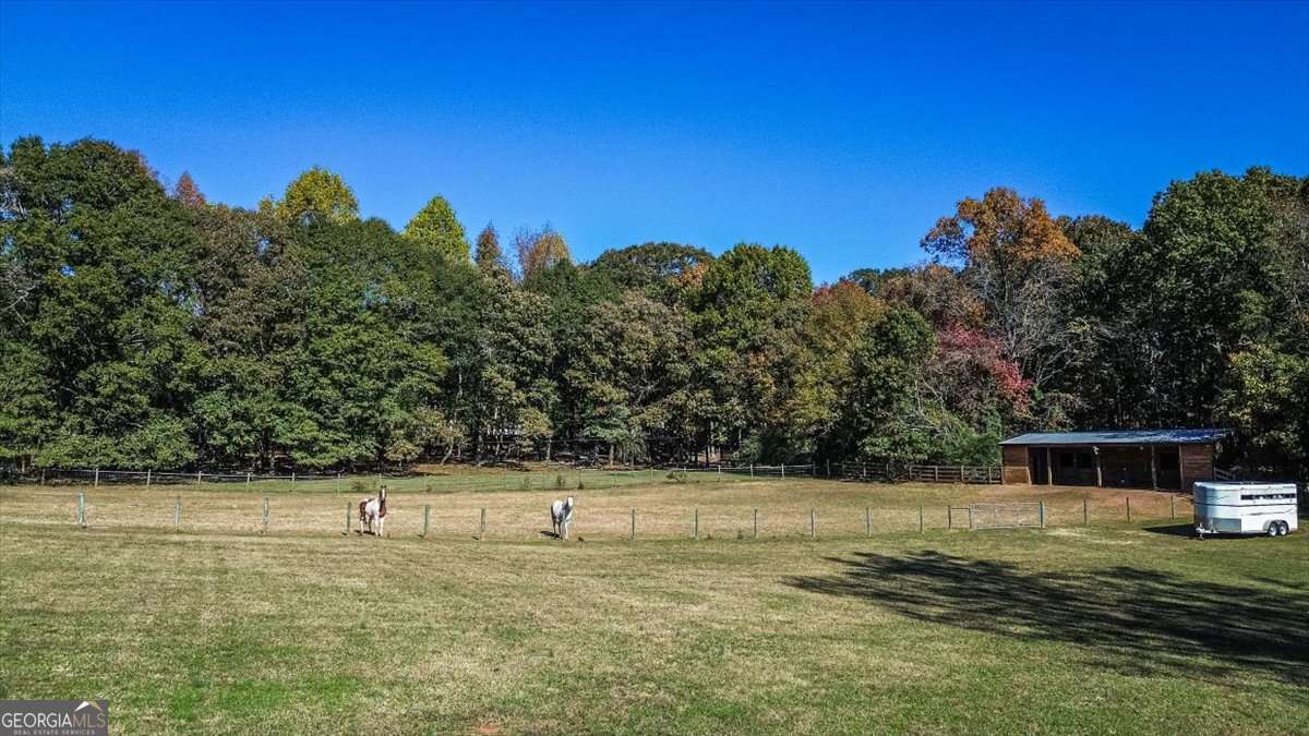 161 Archer Grove Road Athens, GA 30607 - Photo 43 of 56 a view of a yard with a house in the background