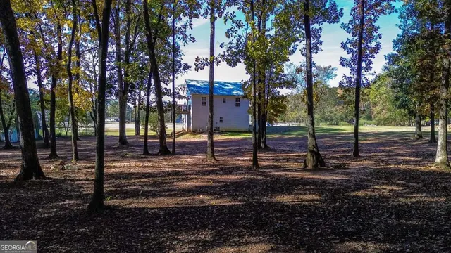 a view of a house with a small yard