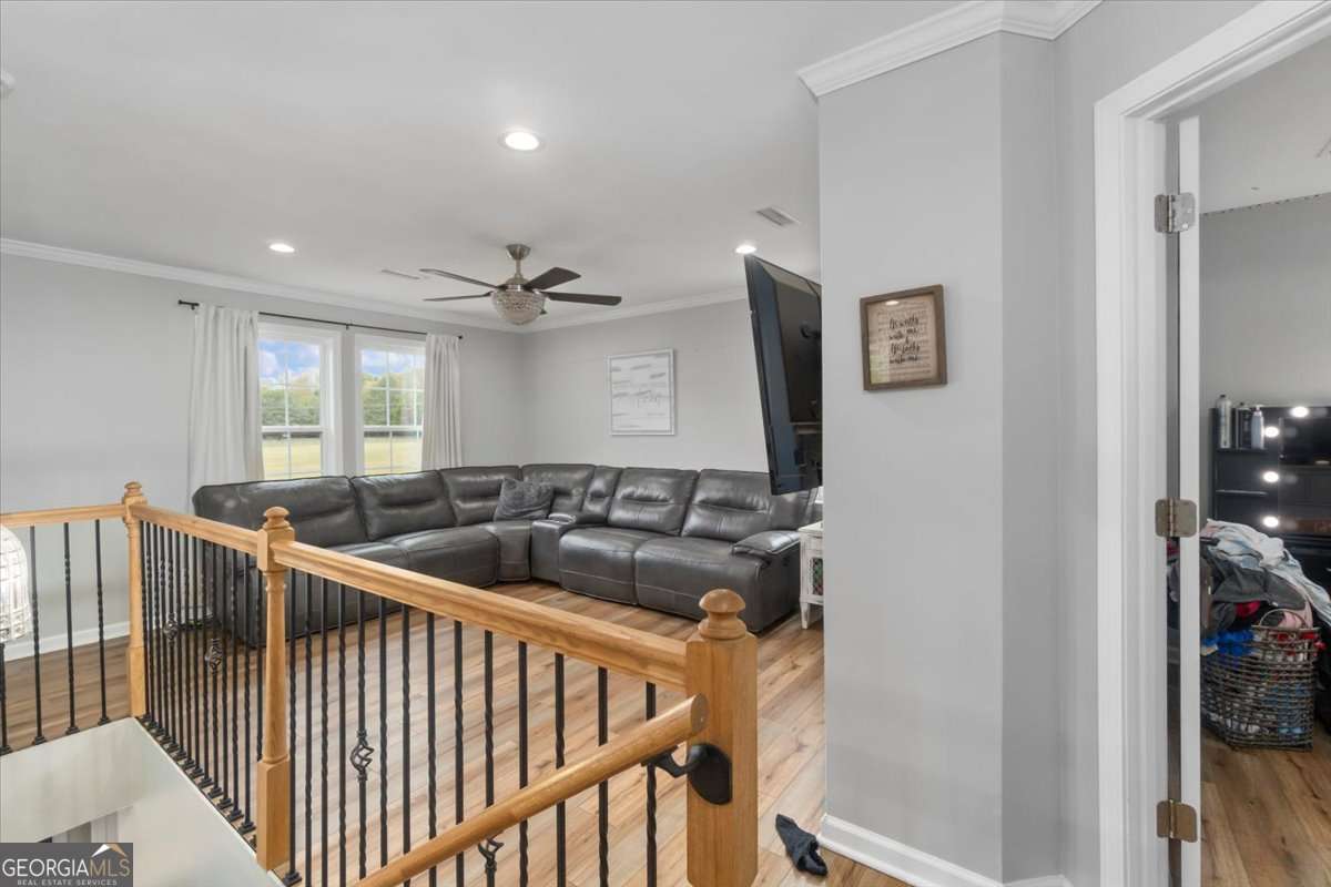 161 Archer Grove Road Athens, GA 30607 - Photo 8 of 56 a view of a hallway with windows and stairs