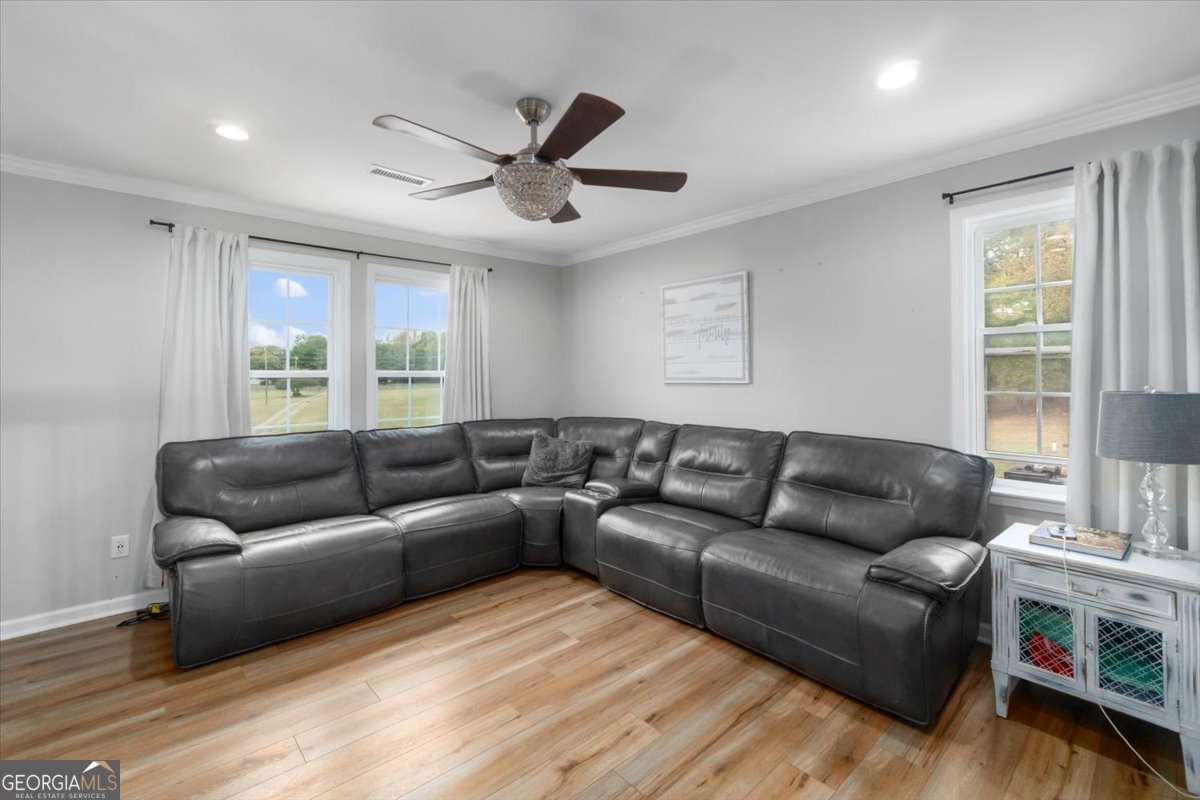 161 Archer Grove Road Athens, GA 30607 - Photo 9 of 56 a living room with furniture and a large window