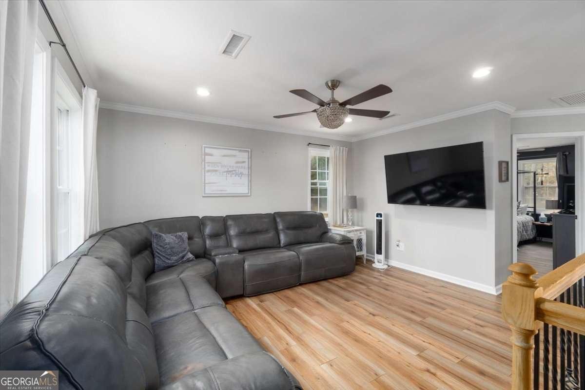 161 Archer Grove Road Athens, GA 30607 - Photo 10 of 56 a living room with furniture and a flat screen tv