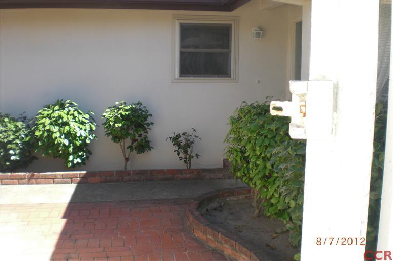4108 Rigel Avenue Lompoc, CA 93436 - Photo 7 of 16 a potted plant sitting in front of a door