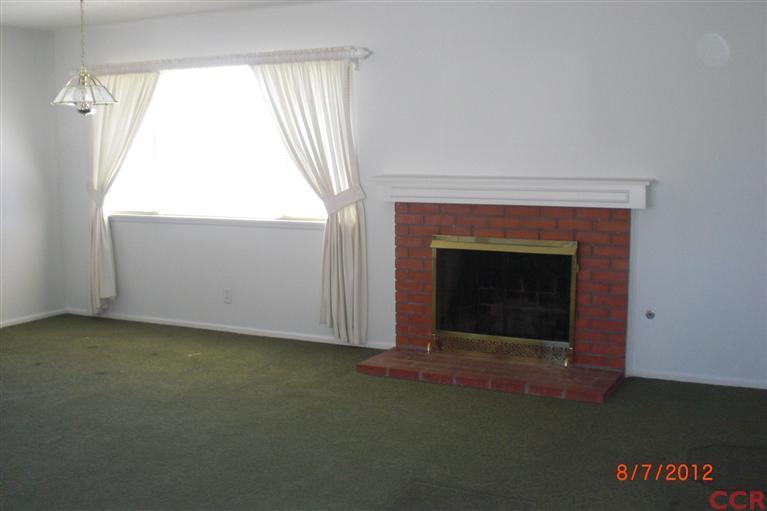 4108 Rigel Avenue Lompoc, CA 93436 - Photo 8 of 16 an empty room with a fireplace