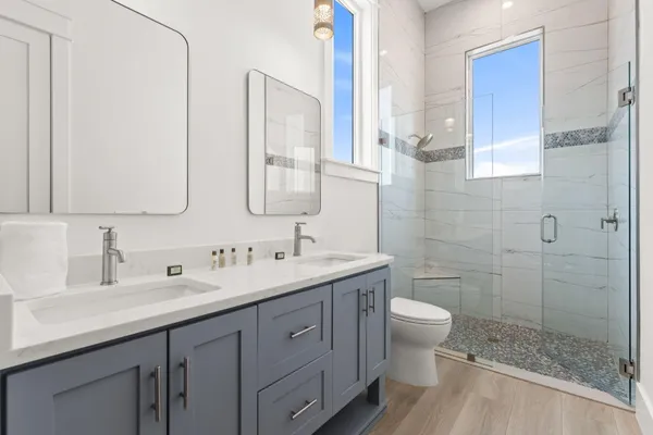 a white bath tub sitting next to a white sink