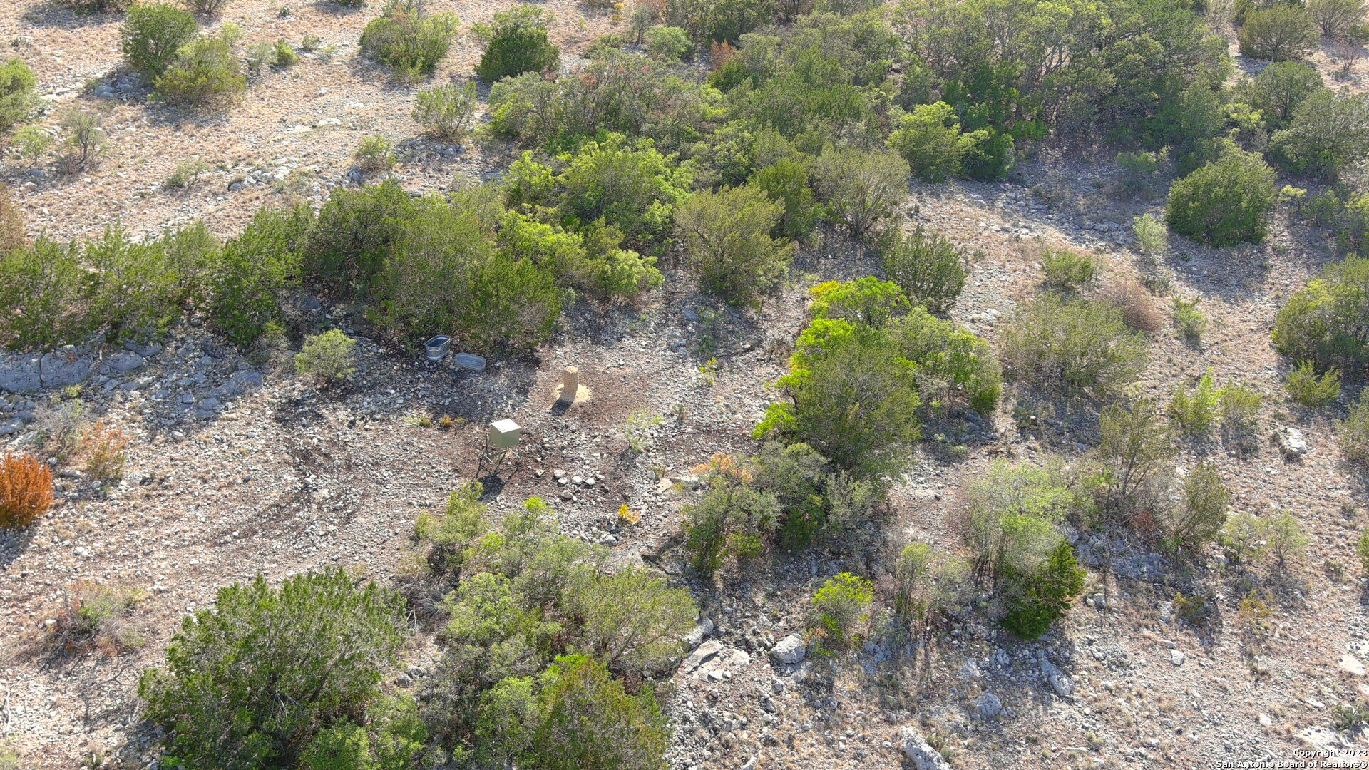 29 Oak Bend Rocksprings, TX 78880 - Photo 17 of 27 a view of a yard with plants and a building