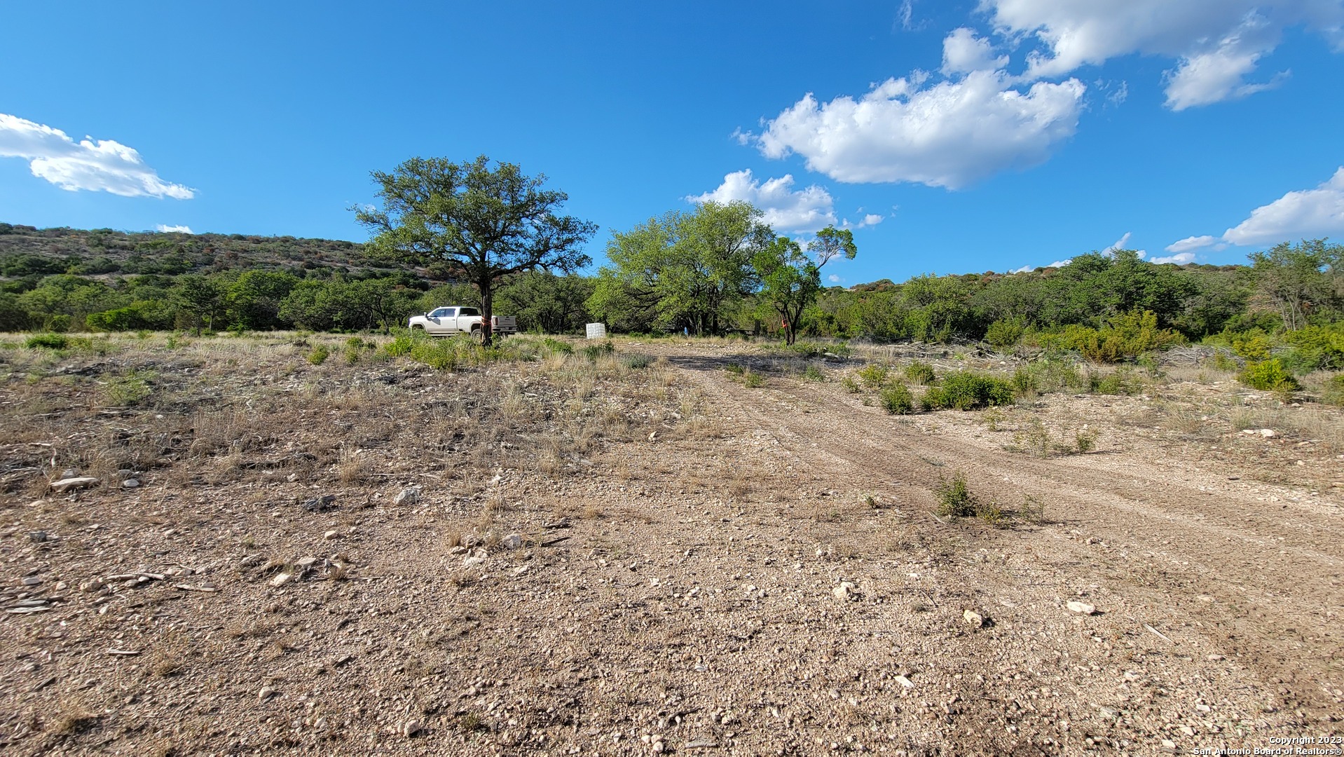 29 Oak Bend Rocksprings, TX 78880 - Photo 6 of 27 a view of a yard with a tree