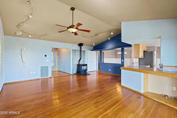 a view of a kitchen with a sink and a floor to ceiling window