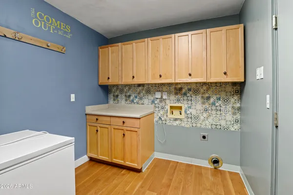 a bathroom with a sink a toilet and vanity