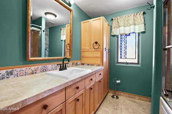 a bathroom with a sink and a mirror