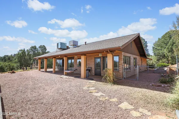 a view of house with a yard in front of it