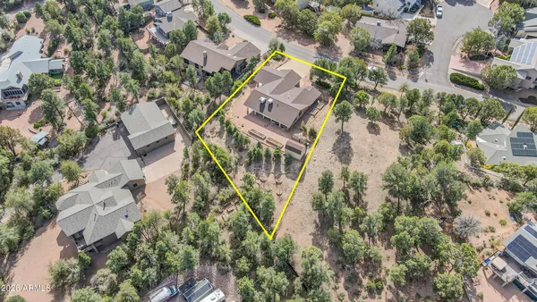 an aerial view of multi story residential apartment building with yard