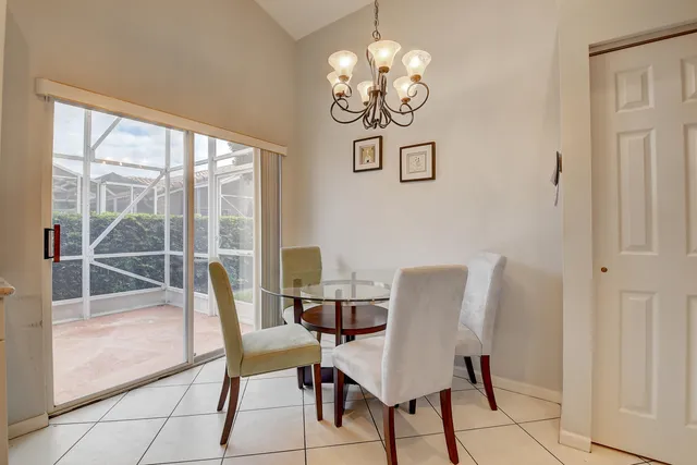 a bathroom with a granite countertop sink a large mirror and a bathtub