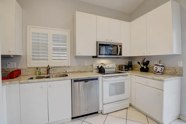 a bedroom with a bed and flat screen tv