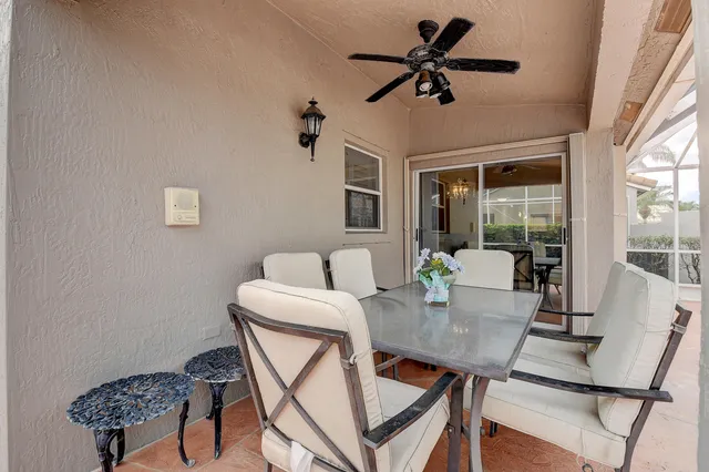 a lobby with furniture and a chandelier