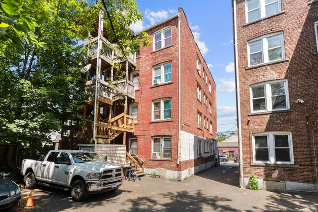 a view of a building with a yard