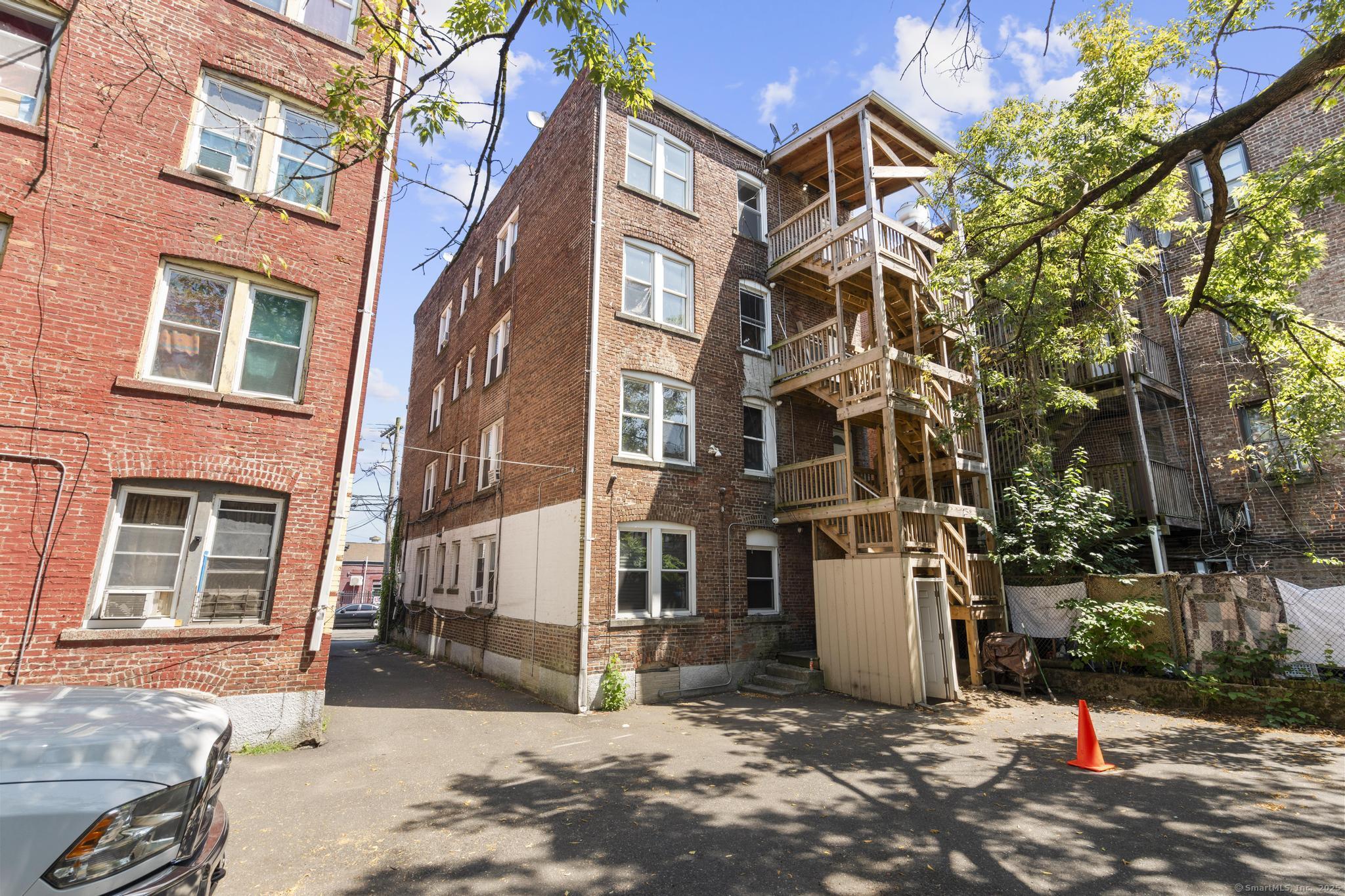 31 Whittier Street Bridgeport, CT 06605 - Photo 13 of 34 a view of a building with a yard