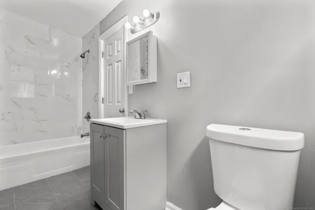 a view of an empty room with stairs and ventilation