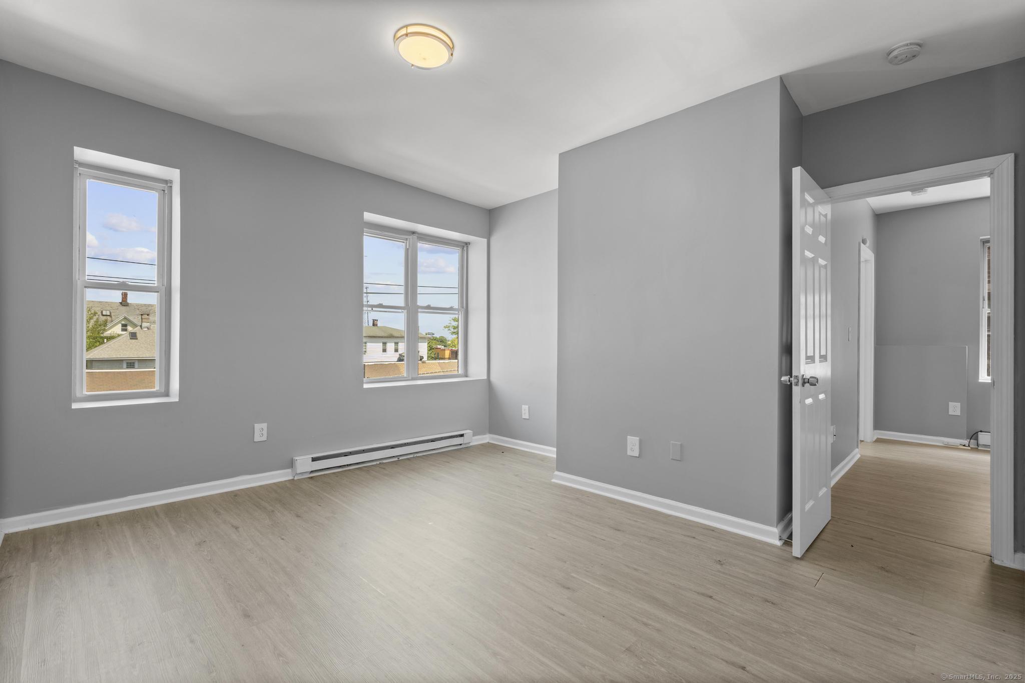 31 Whittier Street Bridgeport, CT 06605 - Photo 26 of 34 an empty room with windows and closet