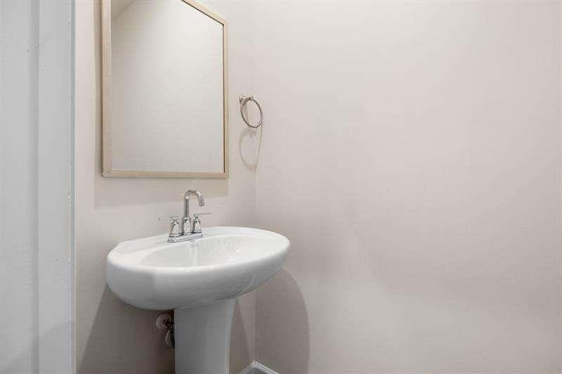 1070 Sunny Lk Drive Lawrenceville, GA 30043 - Photo 11 of 33 a bathroom with a sink and mirror