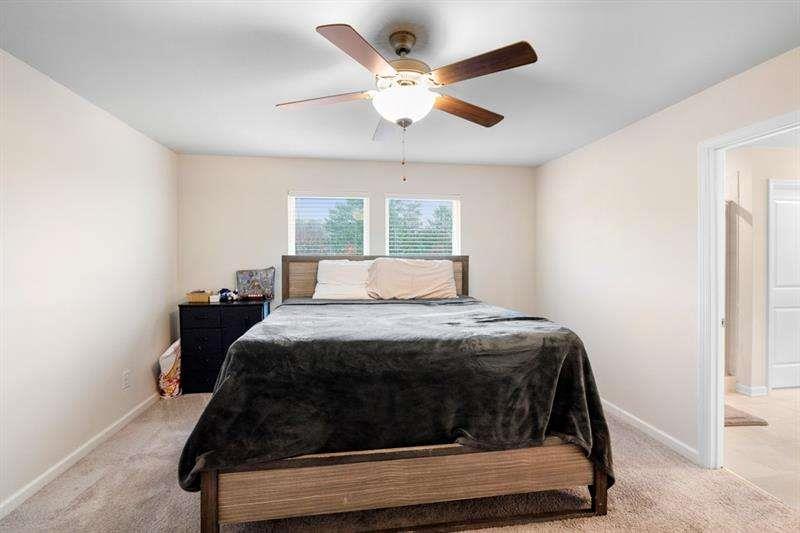 1070 Sunny Lk Drive Lawrenceville, GA 30043 - Photo 26 of 33 a bedroom with a bed and window