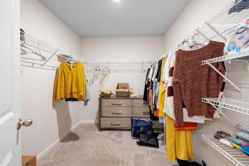 1070 Sunny Lk Drive Lawrenceville, GA 30043 - Photo 31 of 33 a view of walk in closet with clothes and shoes