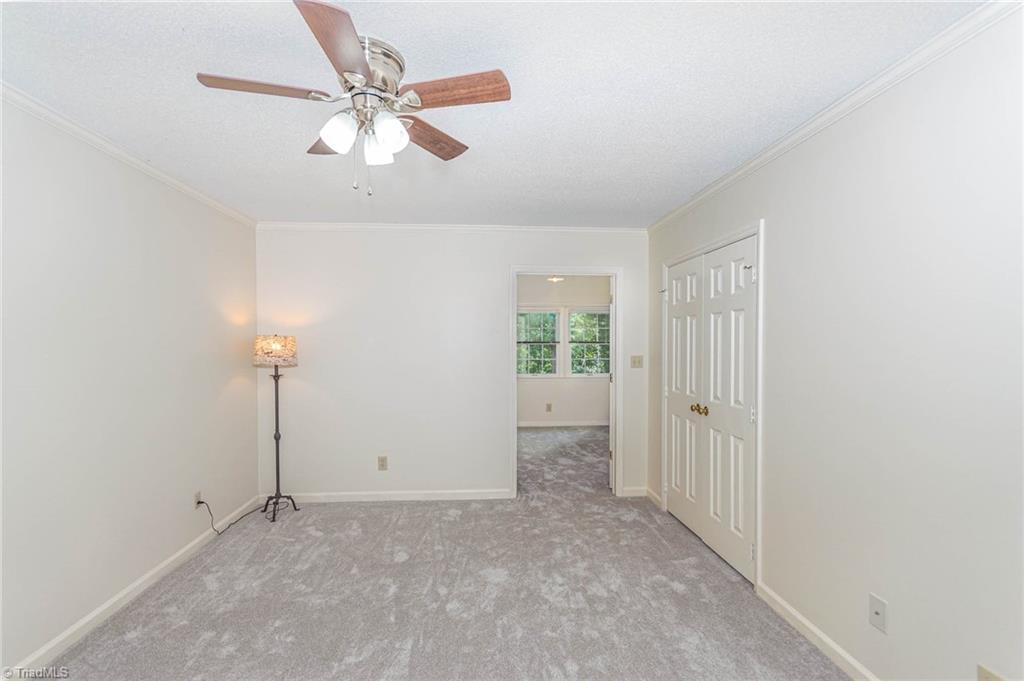 5000 Tower Road, Unit A Greensboro, NC 27410 - Photo 21 of 33 Primary bedroom with an attached full bathroom.