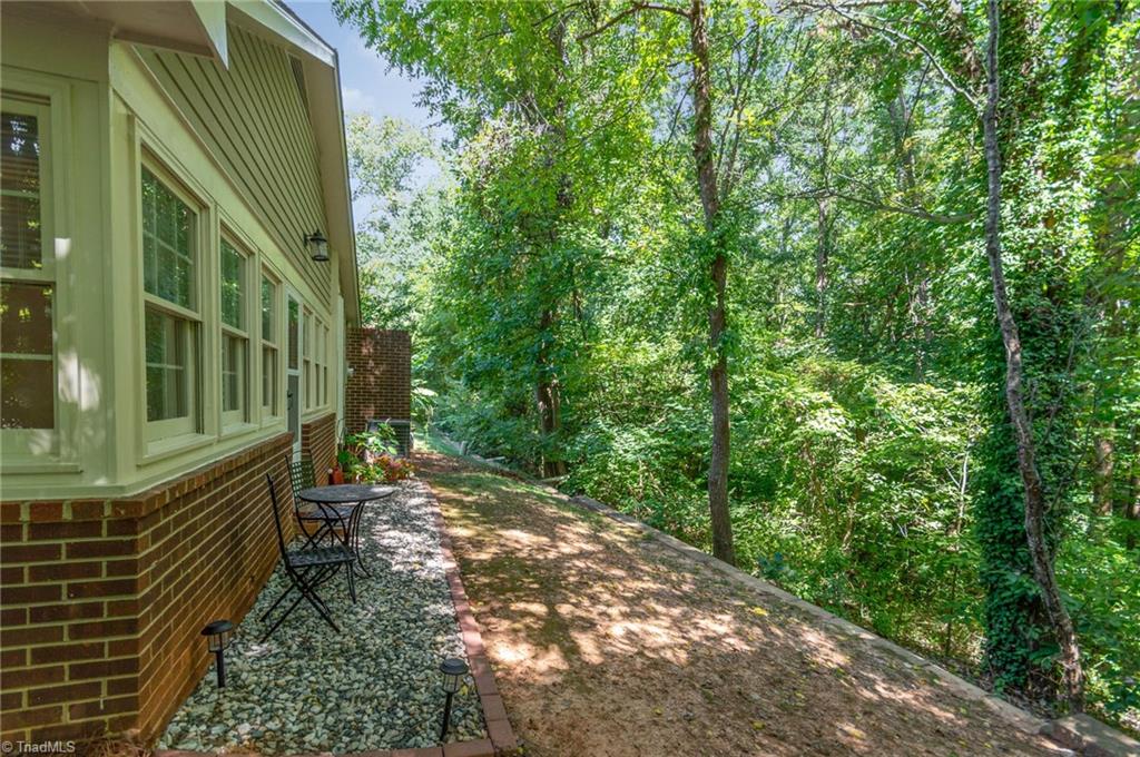 5000 Tower Road, Unit A Greensboro, NC 27410 - Photo 24 of 33 Private backyard surrounded by mature trees.