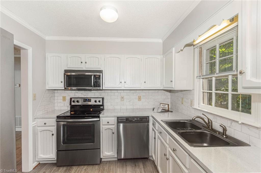 5000 Tower Road, Unit A Greensboro, NC 27410 - Photo 5 of 33 Kitchen. Right after the entry door.