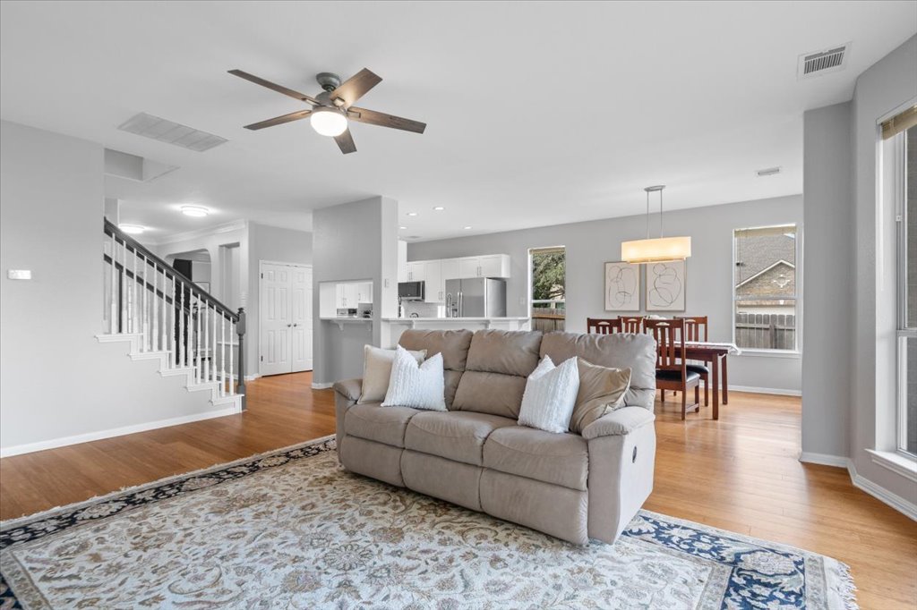 10801 Beachmont Lane Austin, TX 78739 - Photo 12 of 40 Relax at the end of the day in your cozy but spacious living space open to the dining and kitchen