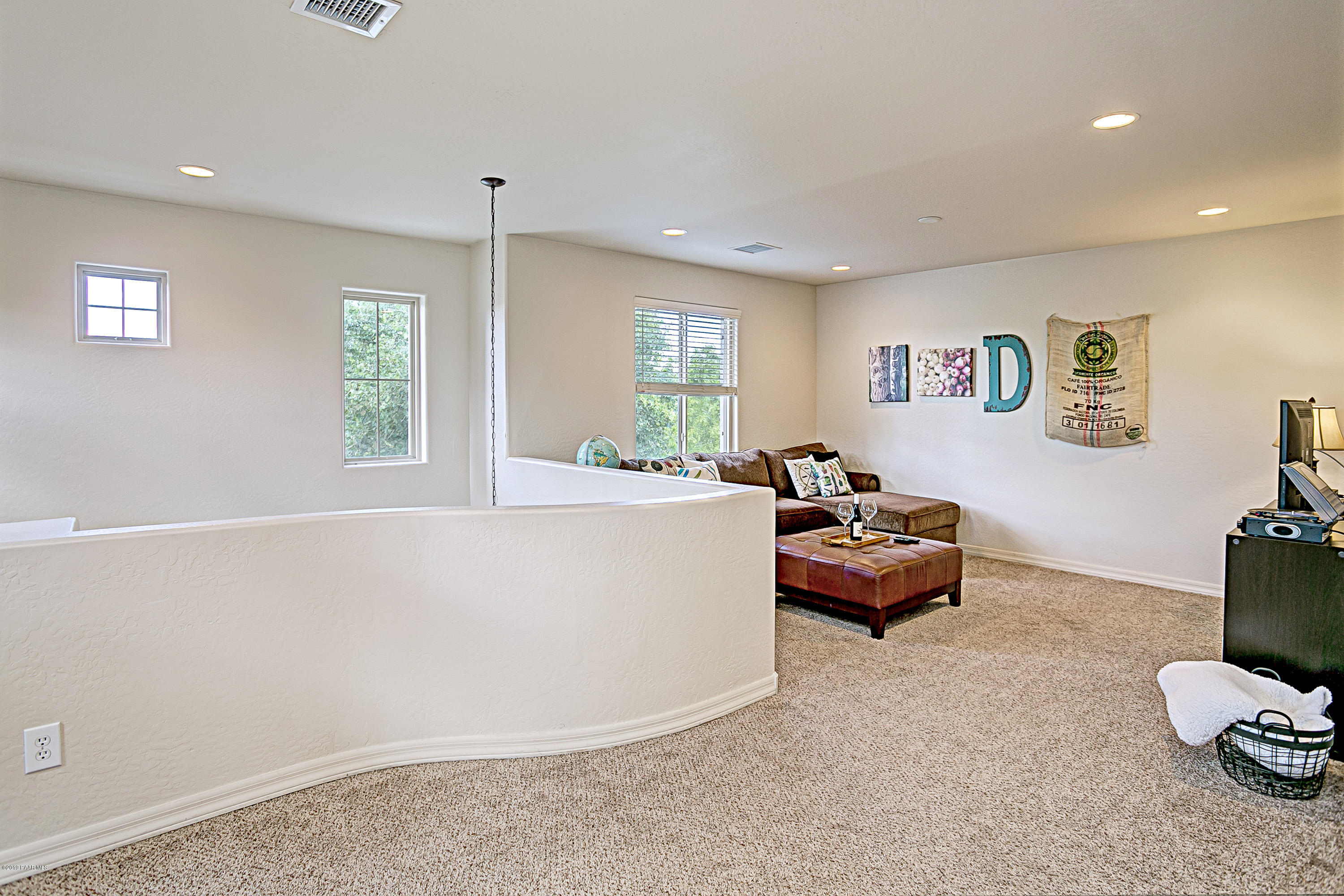7257 Woolsey Ranch Road Prescott Valley, AZ 86314 - Photo 12 of 31 a living room with furniture and a window